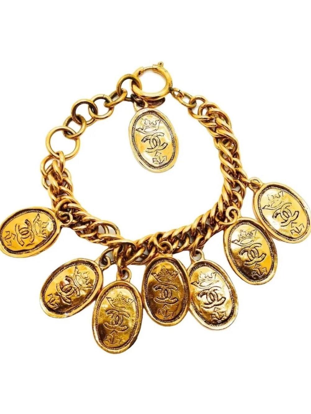 Chanel bracelet,24k gold-plated metal featuring etched CC logo and crown accent